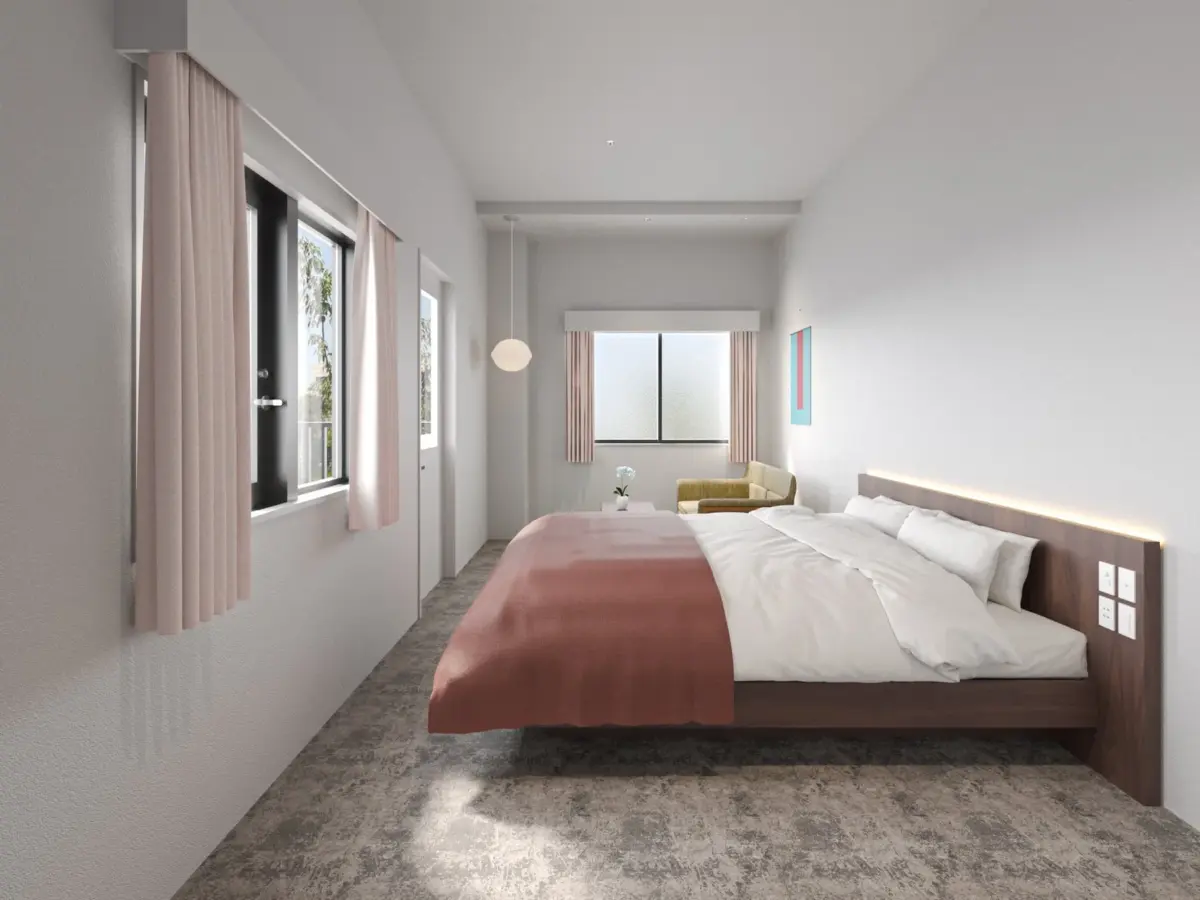 白い壁とグレーの床が特徴のモダンでシンプルな寝室