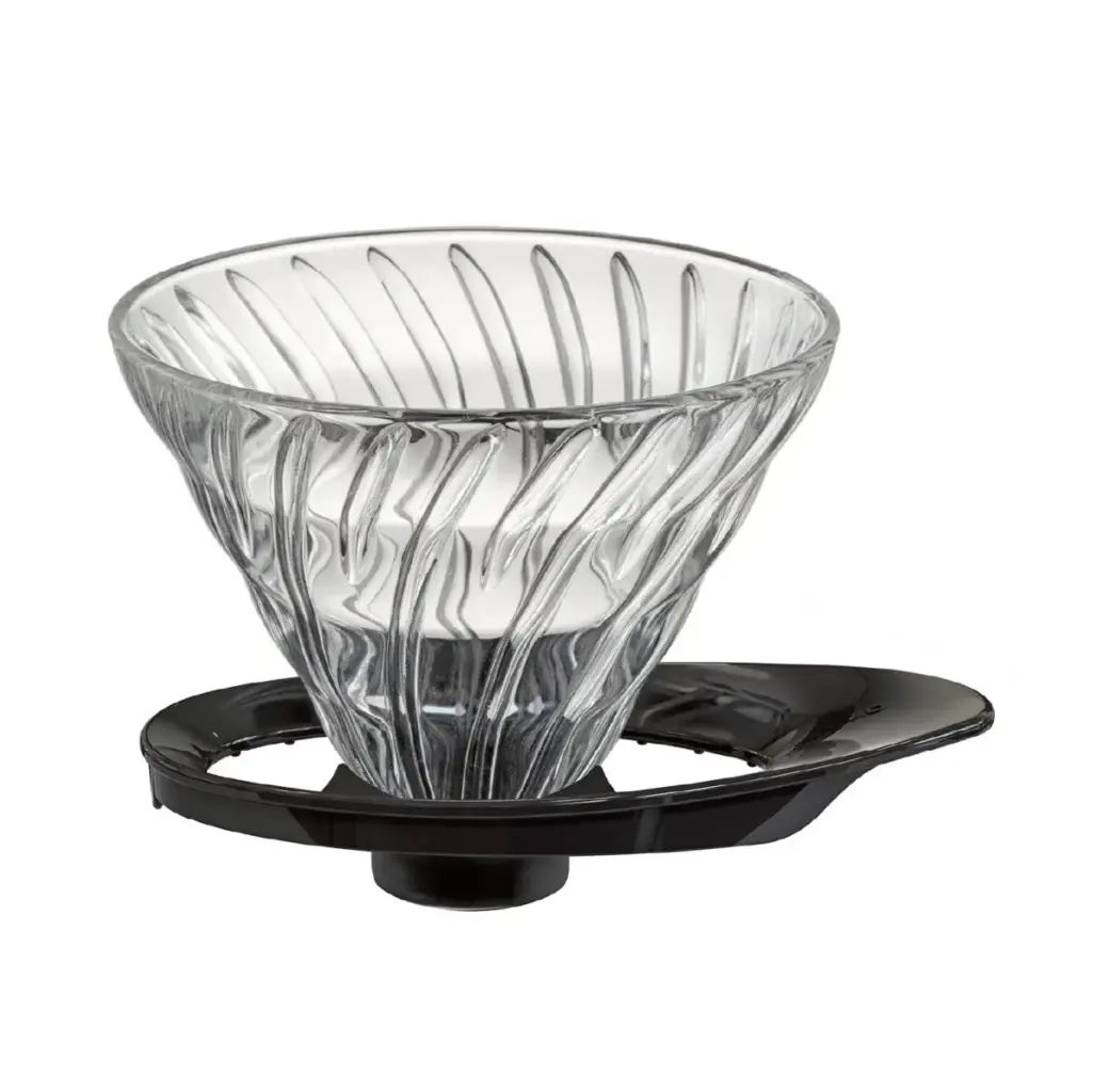 Clear glass conical pour over coffee dripper with spiral ridges resting on a black stand