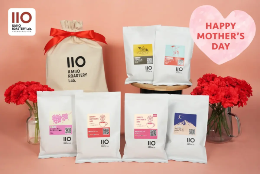 White IIO IlMIO Roastery Lab coffee bags arranged on a pink backdrop with red carnations and a pink heart reading Happy Mothers Day
