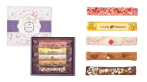 Gift box with five assorted Café Ohzan chocolate bars in decorative wrappers and a floral pattern lid