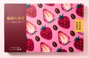 Pink box with a strawberry pattern design and a brown left panel labeled DRIP BAGS for Hashimoto Coffee