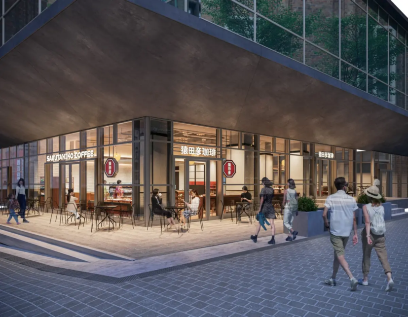 Modern cafe storefront with glass walls outdoor seating and pedestrians along a paved sidewalk under a large overhang