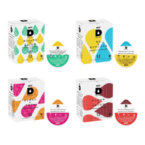 Set of four UCC Drip Pod coffee boxes with colorful teardrop patterns and matching pods