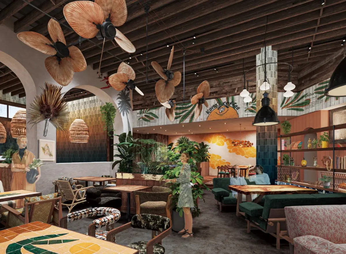 トロピカルでハワイアンな雰囲気のカフェまたはレストランのインテリアです。木製の天井や家具、シーリングファン、観葉植物、モザイク柄のテーブルが特徴的で、リラックスできる空間が広がっています。「Kona's Coffee」のロゴも見えます。