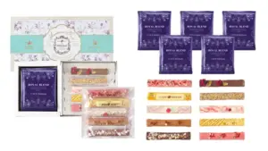 896066fb4f6bef9a45ef3ac3a0a8ee9b | コーヒーステーション Gift box set of Ohzan chocolates featuring purple Royal Blend packets and an assortment of flavored bars in clear wrappers
