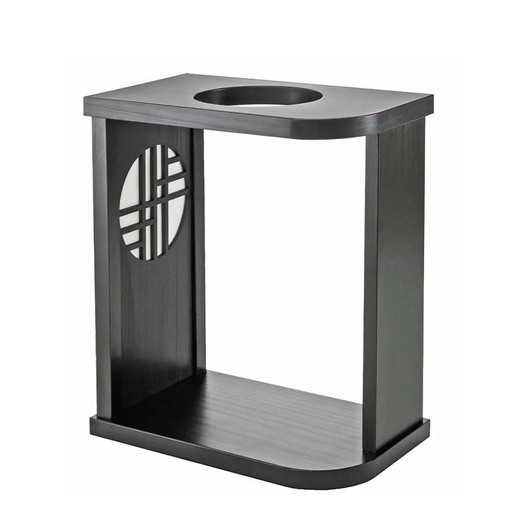 Black wooden end table with a round cutout on the top and a decorative circular lattice panel on the side featuring an open lower shelf