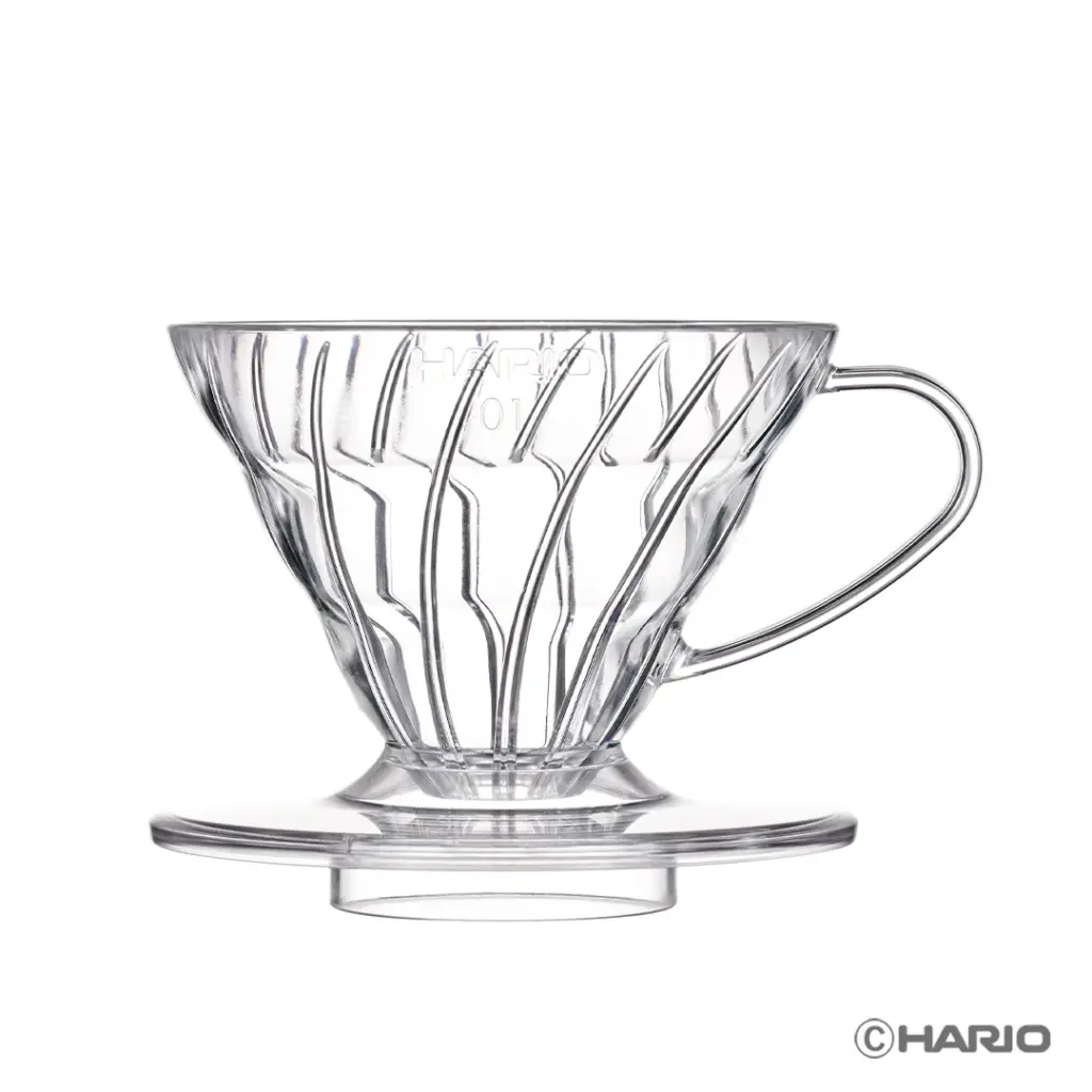 Clear glass pour over coffee dripper with a circular base and handle on a white background