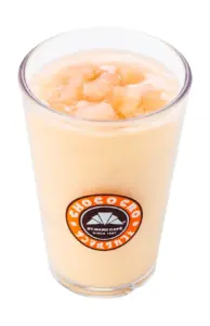 Iced coffee drink in a tall glass with ice and a St Marc Café logo on the front cup