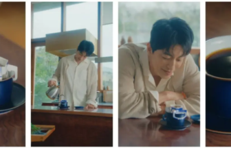 Blue coffee mug on a saucer with a pouring setup and coffee dripping into it