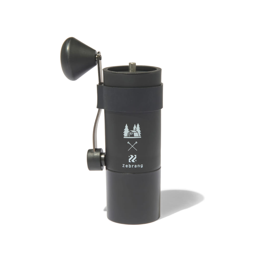 Portable manual coffee grinder with a side crank black cylindrical body and compact design for travel