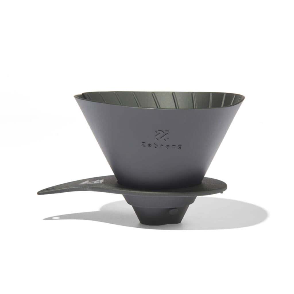 Gray conical pour over coffee dripper resting on a stand ready for brewing with ridged interior
