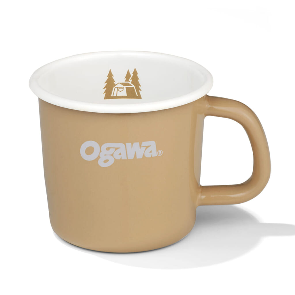 Beige ceramic mug with a white interior and the Ogawa logo on the side camping icon inside the rim area
