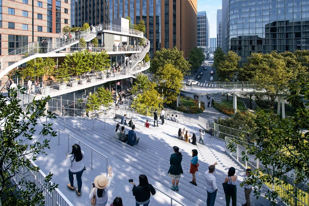 現代的な都市空間に広がる、緑豊かな多層テラスと階段のある広場