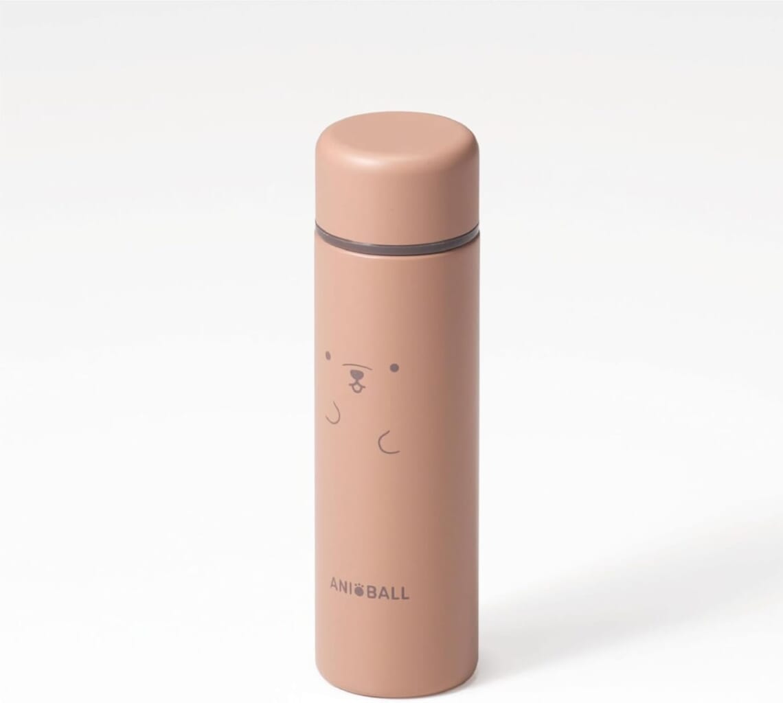 Peach colored insulated bottle with a simple cute face drawing on the body and a matching lid standing upright on a white background