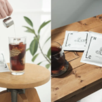 Two panel scene left shows a hand pouring sugar into a tall glass of iced coffee on a round wooden table a white packet labeled HERALD sits beside the glass Right shows a cup of tea with two white HERALDpack packets on a wooden table one being placed near the cup