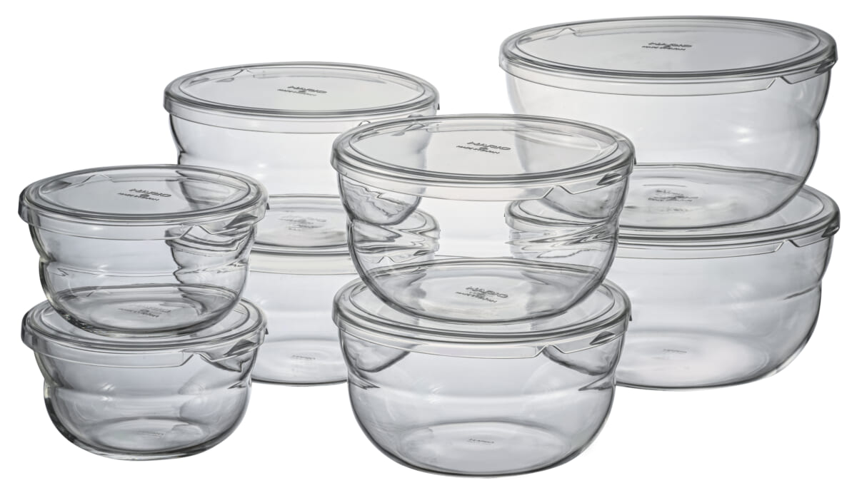 Clear glass food storage bowls with matching airtight lids in multiple sizes stacked together for storage versatility