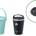 Set of insulated travel mugs in white light blue and black with handles and matching lids plus two separate lids shown nearby