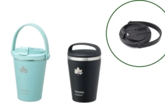 Set of insulated travel mugs in white light blue and black with handles and matching lids plus two separate lids shown nearby