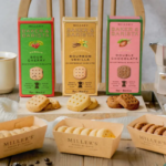 Three Millers Baker  Barista cookie boxes Sour Cherry Bourbon Vanilla Double Chocolate with cookies and a moka pot on a wooden table
