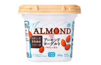 Cup of almond yogurt labeled The ALMOND with almonds on the front and a beige lid packaging shows Japanese text and 300 g unit size