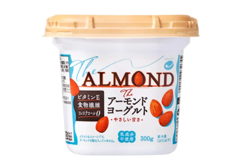 Cup of almond yogurt labeled The ALMOND with almonds on the front and a beige lid packaging shows Japanese text and 300 g unit size