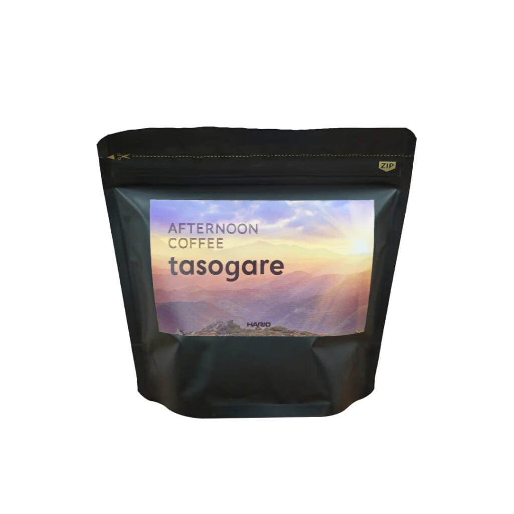 41008d9f6f584c0e46ed88043a3917612acb | コーヒーステーション Black resealable coffee bag with a label reading Afternoon Coffee tasogare and a sunset mountain landscape image on the label