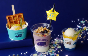 Three colorful dessert cups on a blue background: a waffle sundae, a layered purple/yogurt drink, and a vanilla ice cream cup with toppings and sprinkles.