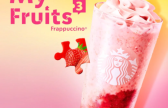 Advertising image for My Fruits 3 Frappuccino with a pink blended drink topped with whipped cream strawberry pieces and a yellow pink gradient background