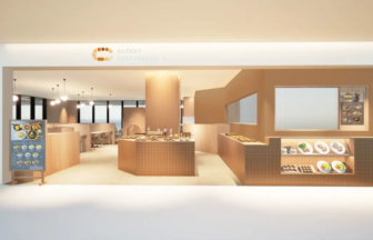 Modern bakery and restaurant storefront with brown tiled counters and a glass display of baked goods