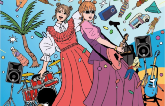 Two women in colorful dresses sing on a stage with guitars and drums under a bright BayFM banner