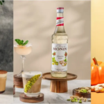 Triptych of Monin syrup bottles with cocktails and garnishes on three distinct backgrounds.