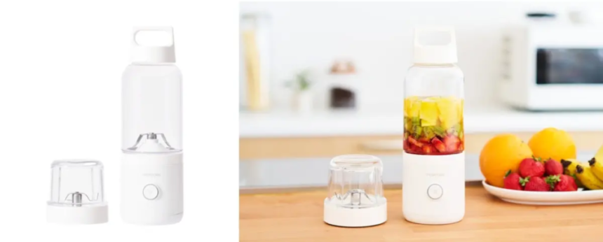 White compact blender with detachable cup and lid placed beside a fruit infuser bottle on a kitchen counter