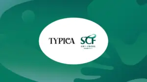 White oval logo centered on a green abstract background featuring the words TYPOICA and SCF with Japanese text