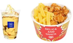 Ice cream sundae with caramel sauce in a clear cup beside a bucket of fried chicken and French fries