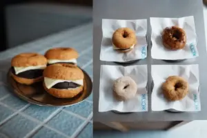 Left a plate of cream filled donuts on a silver tray right four donuts on white wrappers arranged in a 2x2 grid on a gray surface