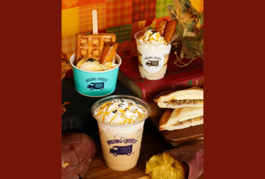 Assorted dessert cups with whipped cream and drizzle plus a waffle sandwich on a wooden board autumn themed backdrop