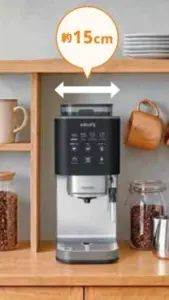 2ad92e5e7f0d75c0740a07ea9a51a442 | コーヒーステーション Krups coffee machine on a wooden kitchen counter with shelves with a speech bubble showing about 15 cm clearance above the machine