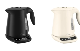 Pair of cordless electric kettles black and ivory on digital bases showing 40 at the display