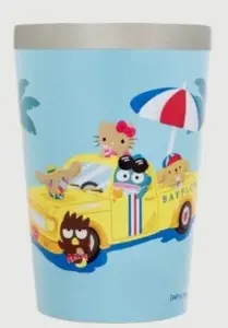Blue cup featuring a yellow cartoon bus with cute animals riding on a sunny beach scene with a red blue striped umbrella and palm trees in the background