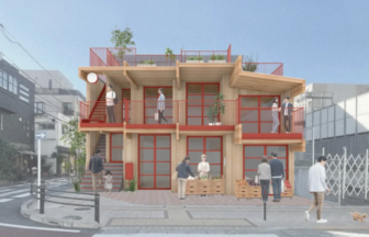 Three story wooden building with red framed glass doors and balconies on a city street several people on the balconies and sidewalk with crates of produce at the entrance