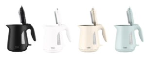 Four electric kettles in black white cream and light blue with lids open arranged in a row T fal