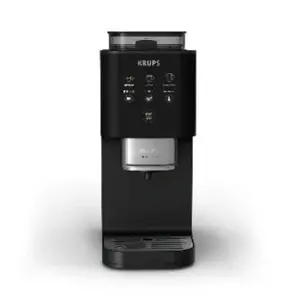 Black Krups espresso machine with a compact tower design and silver coffee outlet set against a white background