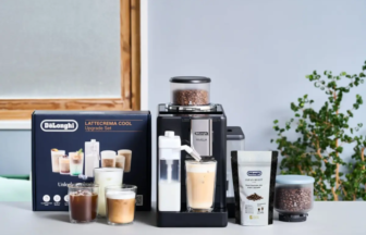 DeLonghi LatteCrema Cool upgrade set with black espresso machine milk pitcher and coffee accessories on a kitchen counter