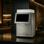Automated drink dispenser labeled Auto Drink Barista on a polished bar counter in a dimly lit lounge